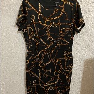 Black dress with gold details. Worn once